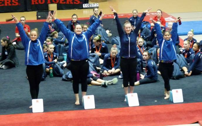 Giant Gymnastics performs well at Rutgers Color Games Emily Rodriguez of Stillwater is in first and Morgyn Witt of Newton is in third with Audrey Biss of Sparta fourth on balance beam.