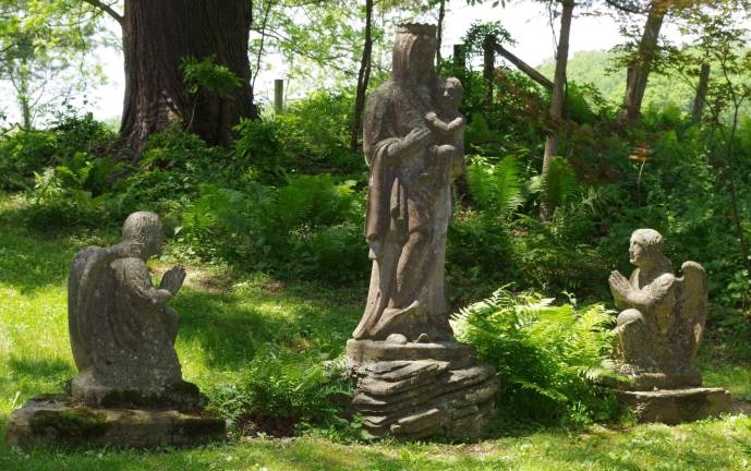 Meadowburn Farm opened for tours Statues in the Evergreen Garden.