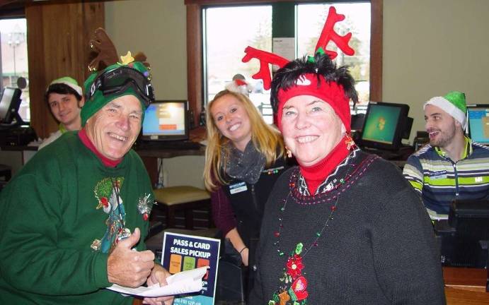 Santa Claus visits Mountain Creek Chris Kooy, Supervisor Jessica Kleeschulte and a fellow staffer are wished a Merry Christmas by John and Buffy Whiting.