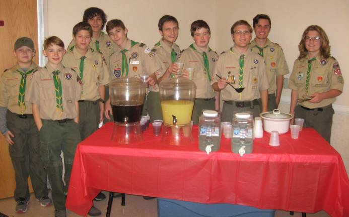 PHOTOS BY JANET REDYKE Boy Scout Troop 283 held a spaghetti dinner fundraiser on Nov. 11 in Boland Hall at St. Francis de Sales Church. The scouts efficiently manned the beverage table.