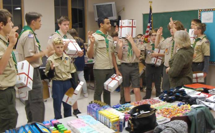 Project organizer Cheryl Avery explains the plan on filling the boxes.