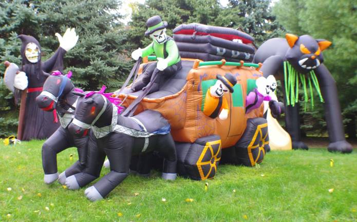 Some of the 105 inflatable decorations at the Ipsale home on Drew Mountain Road. The display is best viewed at around dusk.