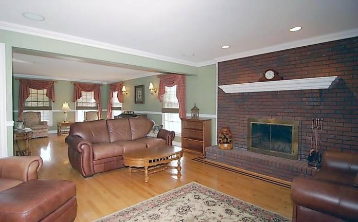 Spacious center hall colonial has in-ground pool