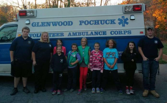 Glenwood Pochuck Volunteer Ambulance members: Tammy, Ed and Andrew assisted Vernon Girl Scout Juniors Troop 94664 on the property steps to follow during an emergency; Check, Call, Care. The scouts have earned their Junior First Aid badge and Safety pin.