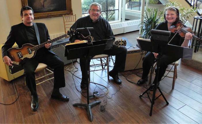 Gary Kraemer,center, his wife Carole (right) and their friend Michael De Maio were one of the ensembles performing at the event.