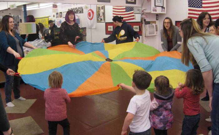 The parachute was a fun activity that pleased the five and under crowd.