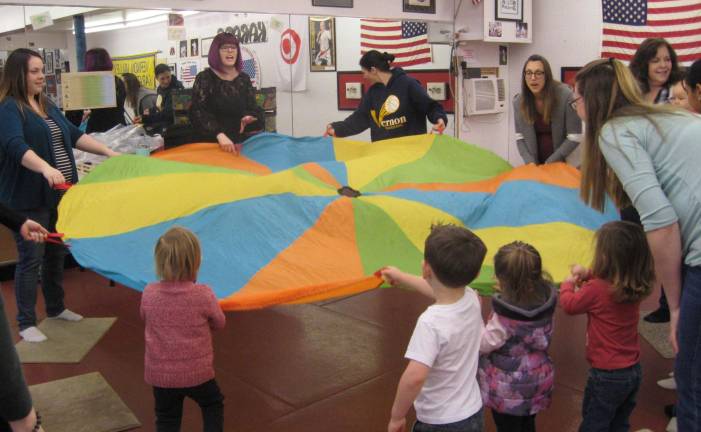 Bumblesong offers music classes to area families The parachute was a fun activity that pleased the five and under crowd.