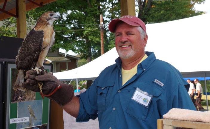 Avian Wildlife Center volunteer Dan Graham of Wantage is shown teaching Wallkill Wildlife Refuge visitors all about this Red Tailed Hawk.