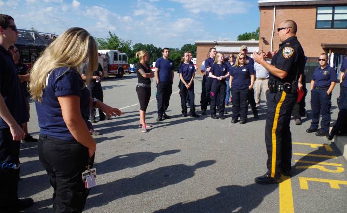 At the right, Vernon Township Police Department Lt. Daniel B. Young explains what will transpire to EMS and the fire department members.