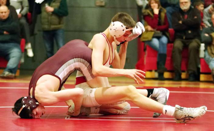 Phillipsburg's James Day wrestles High Point's Clayton Utter in the 106 pound match. Utter won by decision 10-3.