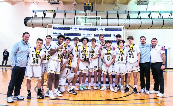 The Vikings pose with the trophy.