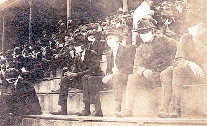 Then and now Fans watching a Georgia Tech football fame in 1918.