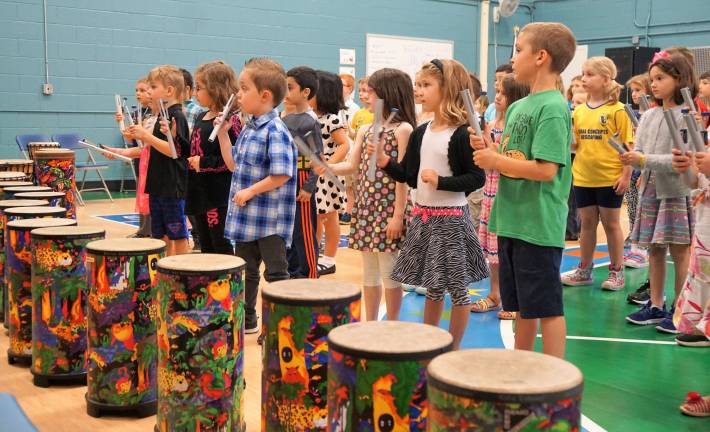 PHOTOS BY VERA OLINSKI Walnut Ridge Primary students play the bells at their music show.