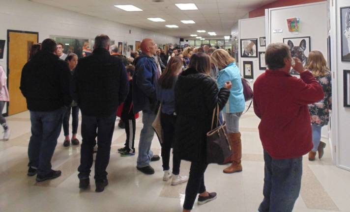 Crowd appreciating the Invitational Art Show at Wallkill Valley Regional High School.