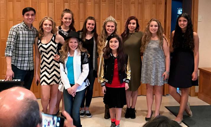 Charity concert raises $800 Queen of the Fair Kelly Wask is shown with performers from a recent charity concert.