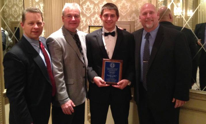 Pictured left to right, Principal Drew Krause, Assistant Football Coach Matt Ferguson, Brandon Lavorini and Head Coach Chuck Tepper.