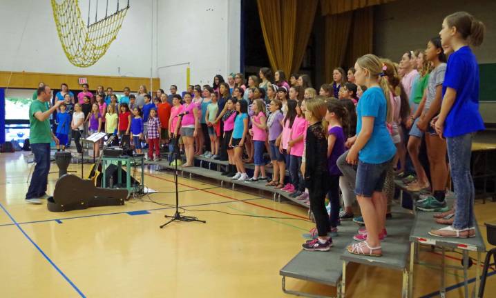 At Lounsberry Hollow Middle School, the students assembled in the gymnasium to offer welcoming songs to the hundreds of visitors.