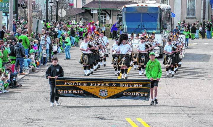 The Police Pipes and Drums of Morris County marches in the parade.