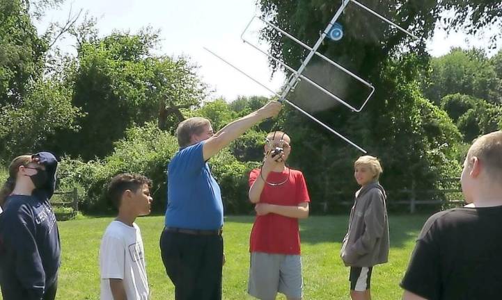 Nashua Area Radio Society president Fred Kemmerer talks to students about capturing satellite messages (Photo provided)