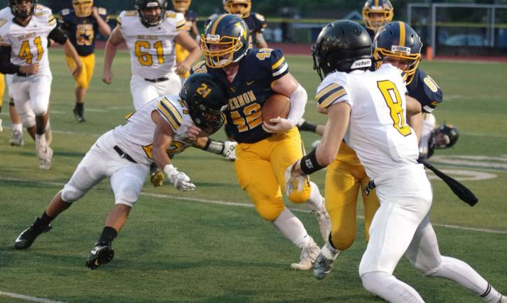 Vernon running back Jeremy Kayhart puts his shoulder into West Milford linebacker Brandon Sanchez in the first half.