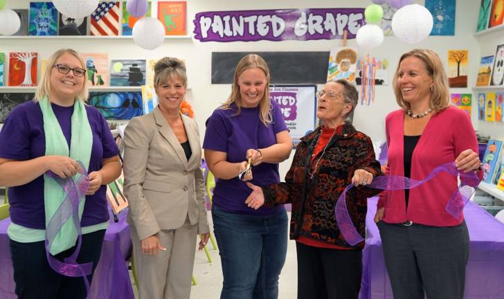 From left, Painted Grape Staff Janell Hrynio, Sussex County Chamber of Commerce President Tammie Horsfield, Painted Grape Art Manager/Founder Beckie Sajban, Hardyston Mayor Leslie Hamilton, and Franklin/Hardyston Chamber of Commerce Chair Jennifer Gardner celebrate the Painted Grape two year anniversary ribbon cutting.