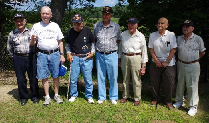 Seven Sussex County veterans of World War II stand together for a group photo.