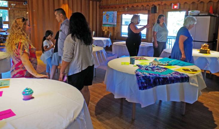 Visitors peruse the entries for the Highland Lakes Budding and Amateur Art and Craft Show and Awards.