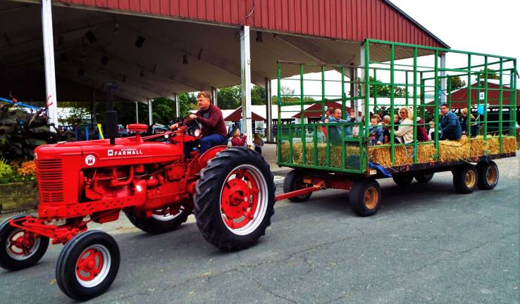 Sussex Christian school holds harvest festival Tractor driver Carl Olinger operates the hayride event at the 38th annual Sussex Christian School Harvest Festival Oct. 1.