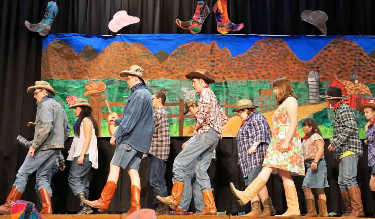 PHOTO BY VERA OLINSKI Students country line dance to &quot;Achy Breaky Heart.&quot;