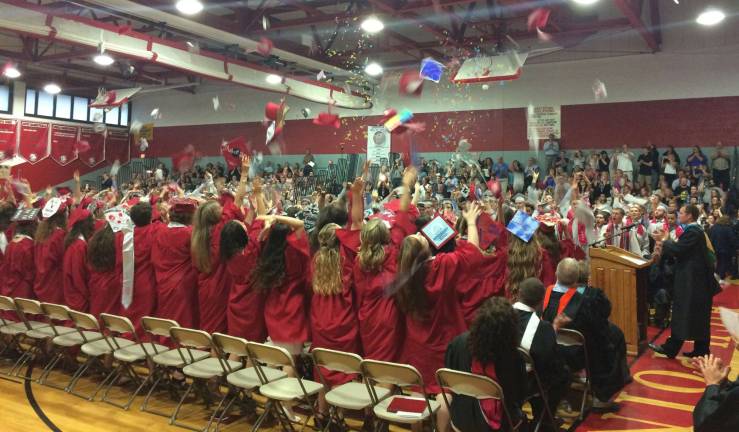 Students throw their caps and confetti at the close of the High Point Regional High School graduation ceremony for the Class of 2017 held June 19, 2017.