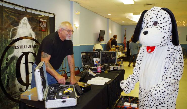 &quot;Dippy the Dalmatian,&quot; Rob Mantore, learns some new tricks from &quot;Ghost Buster&quot; Michael Boyd of the Central Jersey Paranormal Research Group. Dippy spent the day at the Elks Lodge. Photo by Chris Wyman.