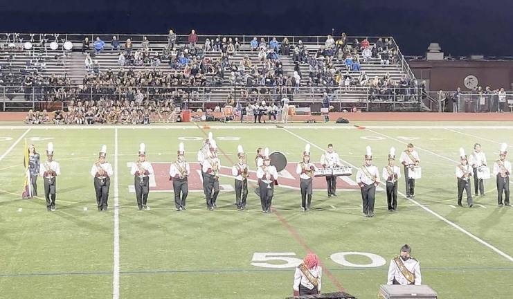 ‘Oh when the band begins to play’ The Newton High School Marching Band at Friday’s season opener football game performing on the field (Photo provided)