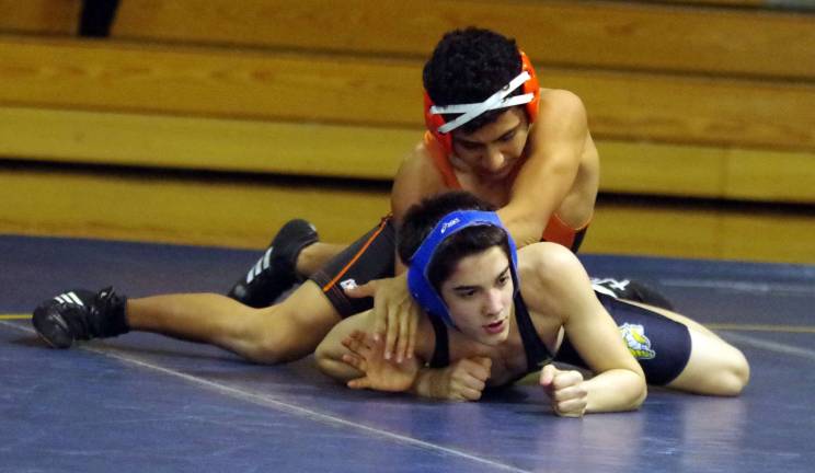 Dover's Daniel Campos on top of Vernon's Logan Folb in the 126 Ib category.