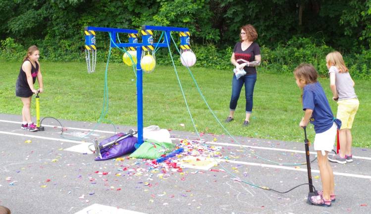The children enjoyed using air pumps to explode balloons.