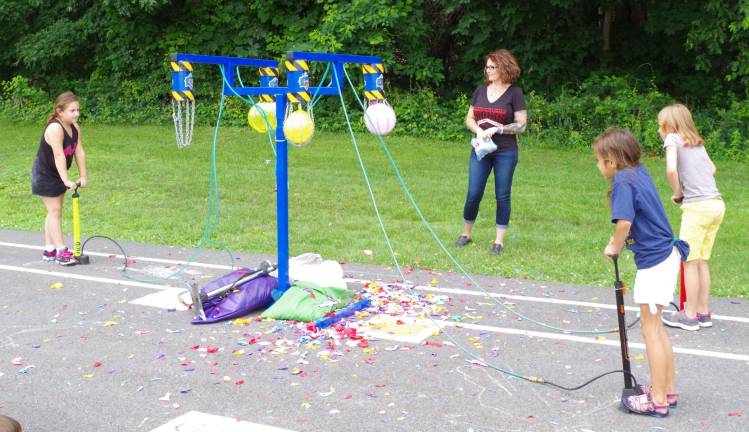 Walnut Ridge closes school with carnival The children enjoyed using air pumps to explode balloons.