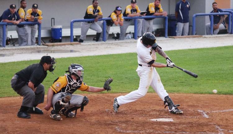 Sussex County Miners batter Carl Thomore hits the ball in the third inning.