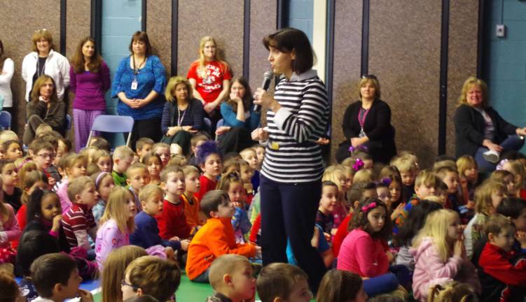 Principal Rosemary Gebhardt speaks to the students about the video they are about to watch.