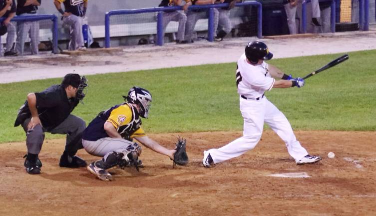 In the fourth inning after being hit the ball bounces off of the foot of Sussex County Miners batter Dustin Lawley.