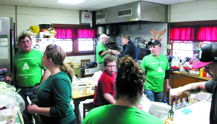Church hosts third annual Christmas dinner Photo by Viktoria-Leigh Wagner Wantage United Methodist members and volunteers bustling about the kitchen at the First Baptist Church in Sussex.