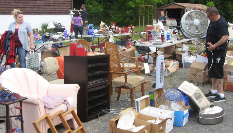 Browsers look for deals on the June 3rd church yard sale.