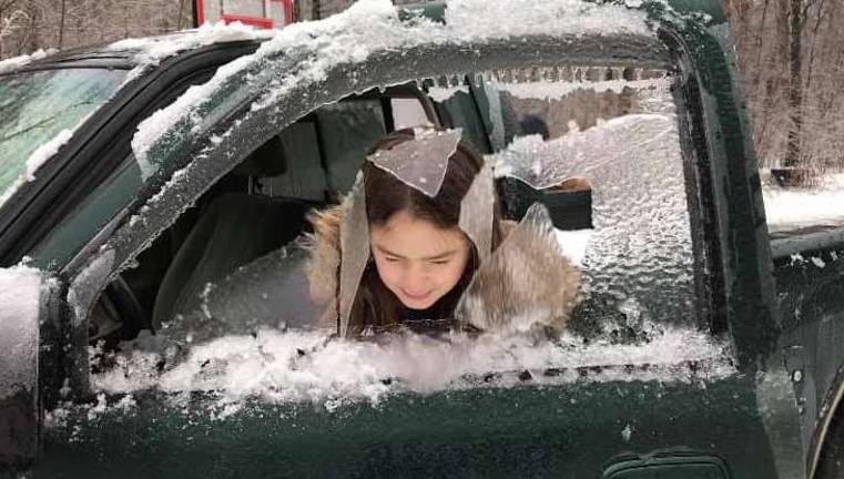 Winter Storm Harper ices county This photo by Laura White shows Lauren White, of Stillwater, has some fun with the ice during the storm.