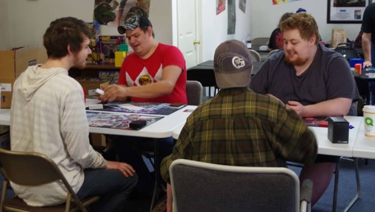 Players start a round of Yu-Gi-Oh in the game room at Bob&#xfe;&#xc4;&#xf4;s Collectables in Hardyston.