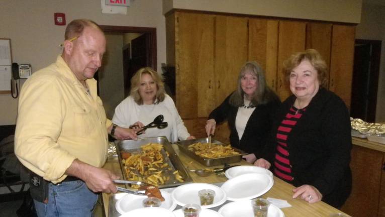 Members of the congregation help serve the Beemerville Church's Lenten Fish Dinner.