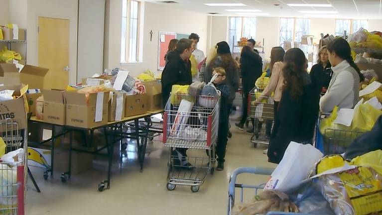 St. Francis de Sales Food Pantry distributed Thanksgiving food baskets on Saturday November 23.