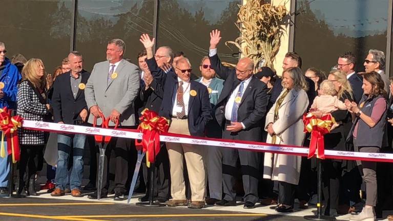 Waving at the crowd are David Romano, left, RoNetco Supermarkets co-president and chief financial officer, and Dominick Romano, RoNetco co-president and chief operating officer. RoNetco owns the new ShopRite of Sussex. (Photo by Kathy Shwiff)