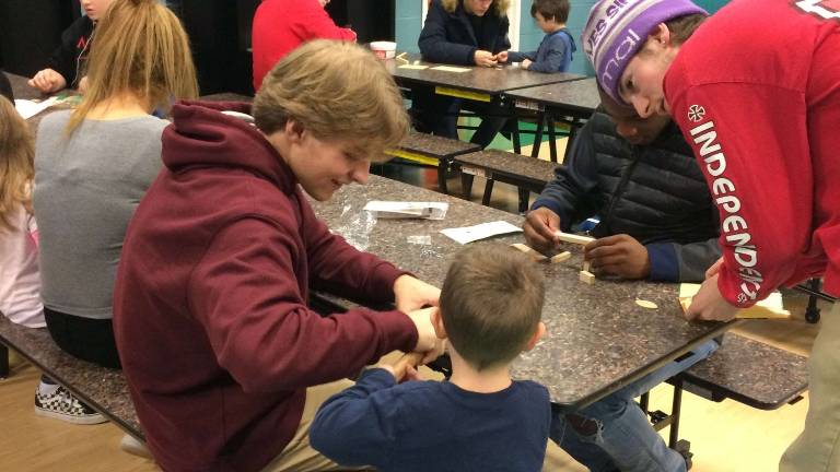 High school students build with preschoolers High school students build with preschoolers