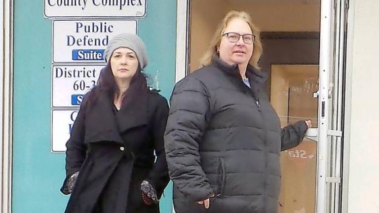 Museum director agrees to shun alcohol as Christmas lights vandalism case advances Lori Strelecki (right) emerges from the John Street County Complex in Milford (Photo by Frances Ruth Harris)