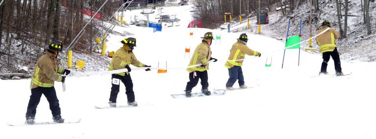 State and local firefighters race for burn center Shown on their winning first place race is the Linden Fire Department.