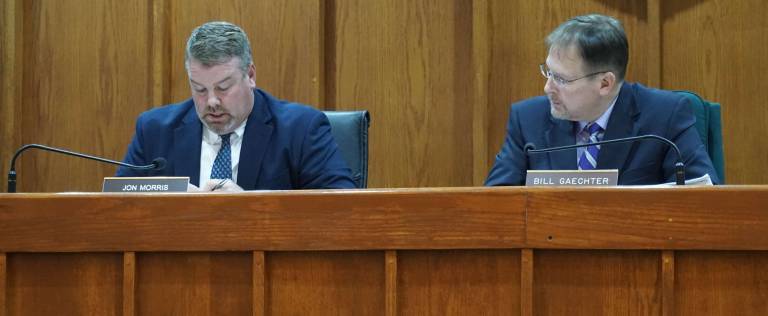 PHOTOS BY VERA OLINSKI Wantage Committeeman Jon Morris, left, reads a resolution to buy a $524,377 rescue pumper on Nov. 12.