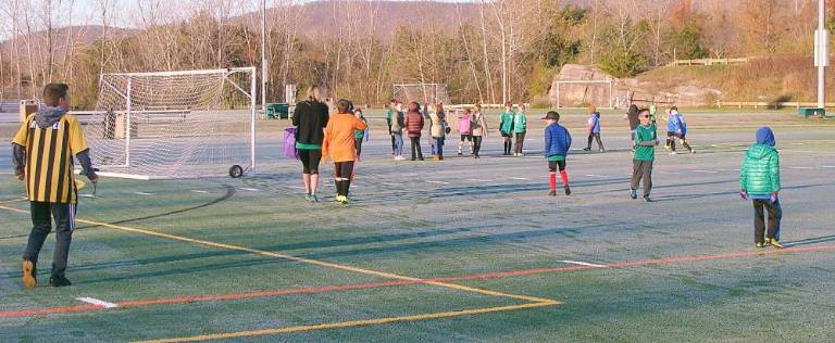 Children swarmed the fields after the ribbon cutting, ready to play four scheduled soccer games.